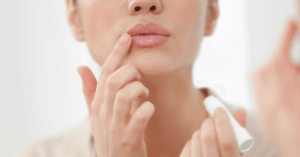 close up of women touching her lips and wondering the cost of lip filler in Canada