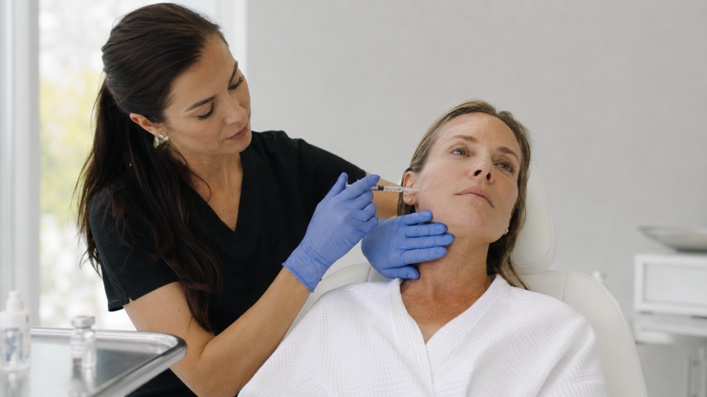 Nurse injector performing Sculptra collagen stimulator treatment on a patient's cheek at Infinite Medical Spa in London, Ontario