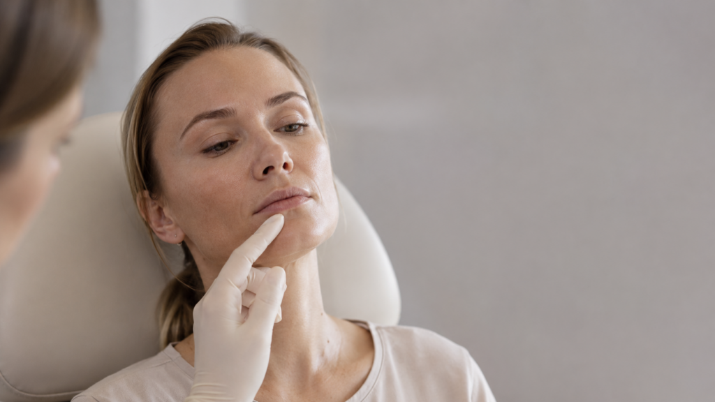 Injector assessing lip filler migration at a medical spa in London, Ontario